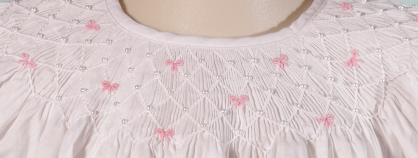 White Geometric Smocked Short Sleeve Bishop Dress featuring Little Pink Bows