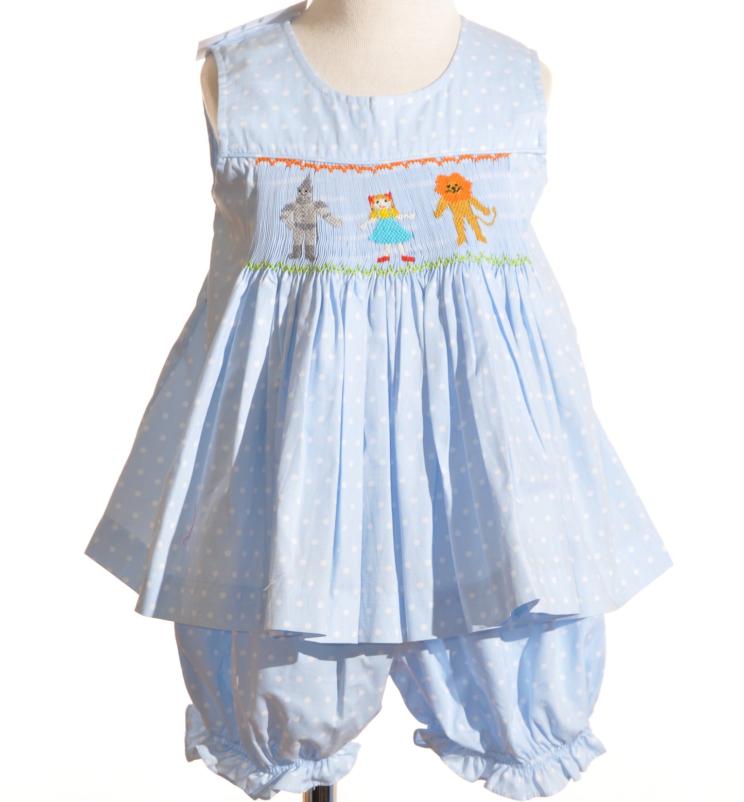 Light Blue Polka Dot Bubble Rompter featuring WIZARD OF OZ HAND-SMOCKED