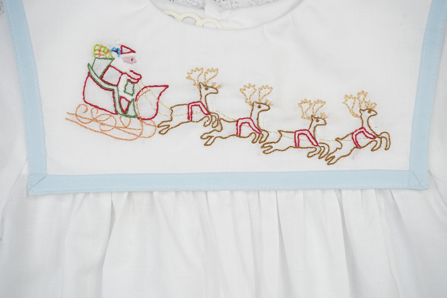 Boy White Christmas Bubble Featuring Blue Trimmed Sailor Collar & Delicate Santa and Reindeer Embroidery