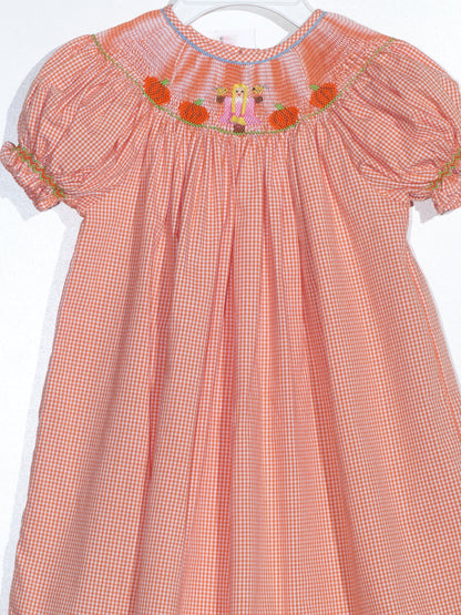 Orange Gingham Short Bishop Sleeve Dress featuring GIRL WITH BRAIDED HAIR & PUMPKINS Smocked (Copy)