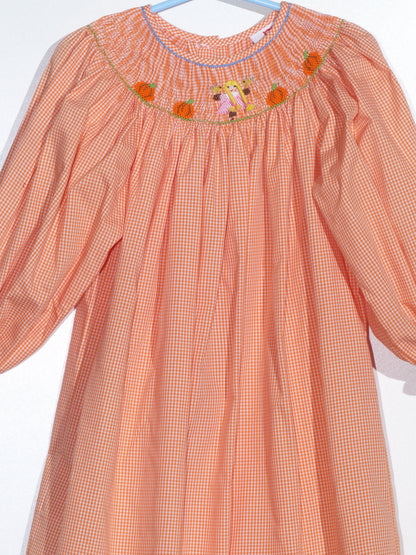 Orange Gingham Long Bishop Sleeve Dress featuring GIRL WITH BRAIDED HAIR & PUMPKINS Smocked