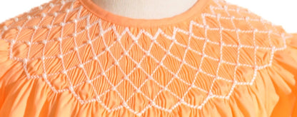 Orange Geometric Smocked With Pearls Short Sleeve Bishop Dress