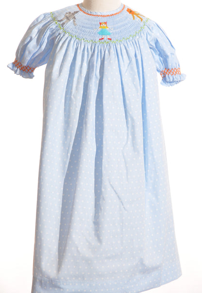 Light Blue Polka Dot Short Sleeve Dress featuring WIZARD OF OZ HAND-SMOCKED