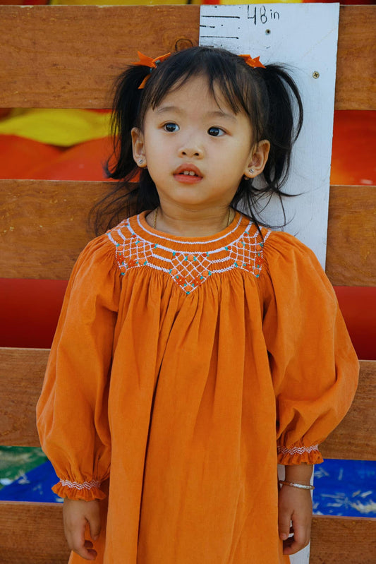 Orange Corduroy Geo Smocked Long Bishop Sleeve Dress
